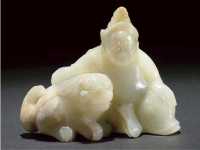 Ming Dynasty A celadon and russet jade figural group